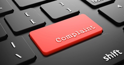 Red key on keyboard marked complaint